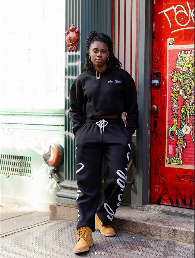 Naturally Nyla client with locs in streetwear — urban portrait